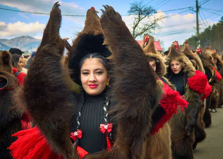 People dancing dressed in bearskin and folk costumes at the Comanesti Customs and Traditions Festival on December 30, 2025のeditorial素材