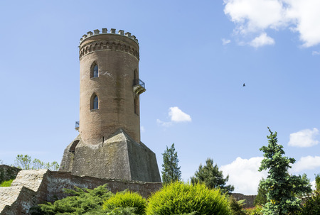 Medieval cylindrical , brick tower placed on higher ground as an outpost for observation and defenseのeditorial素材