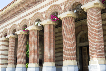 Row of brick columns of a cathedral entrance in byzantine architectural styleの写真素材
