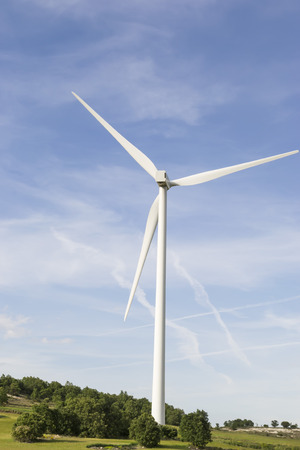 Single wind turbine installed on a hillの写真素材