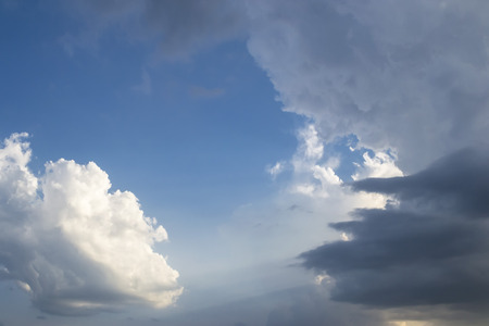 Typical storm clouds gathering fast and forecasting rain and thunderstorm in hot summer seasonの写真素材