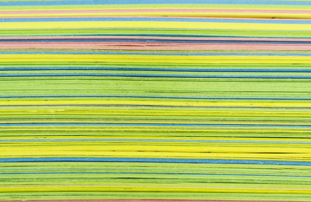 Multicolored paper layers used for office notes in close-up, backgroundの写真素材
