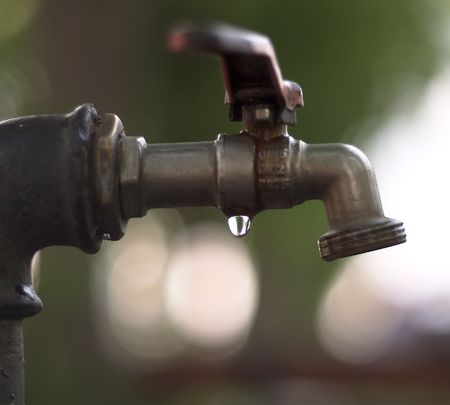 the tap in the gardenの写真素材