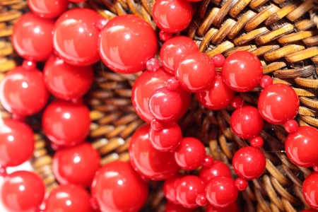 Red Necklace over brown basket backgroundの写真素材