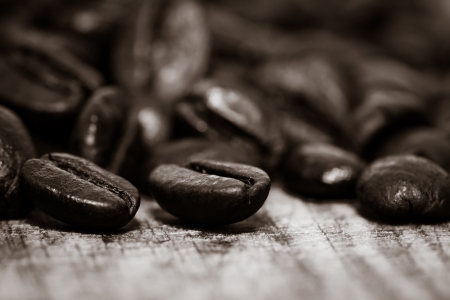 Coffee beans on grunge wooden background の写真素材