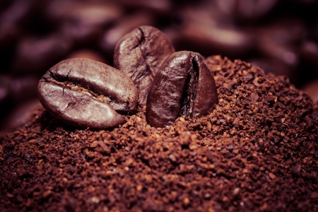 Coffee beans on grunge wooden background の写真素材