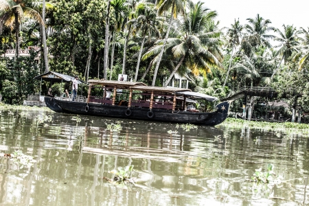 House boat in backwaters near palms in Alappuzha, Kerala, India ( HDR image )のeditorial素材