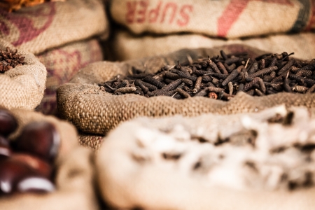 Spices and herbs in bags at market in India ( HDR image )
