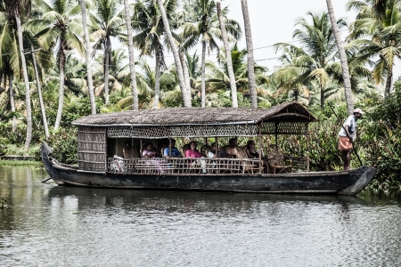 House boat in backwaters near palms in Alappuzha, Kerala, India ( HDR image )のeditorial素材