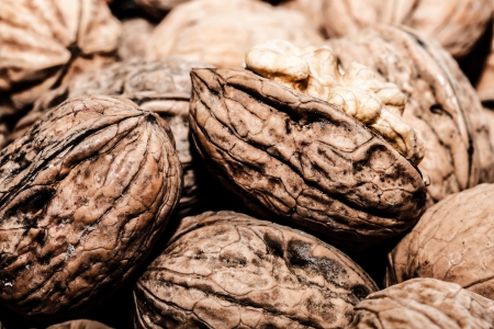 Walnuts in shells, one upon the other ( HDR image )の写真素材