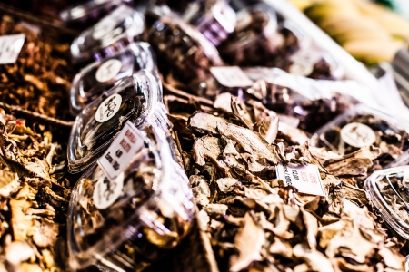Heap of dried edible mushrooms on the market の写真素材
