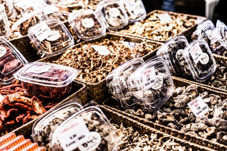 Heap of dried edible mushrooms on the market の写真素材