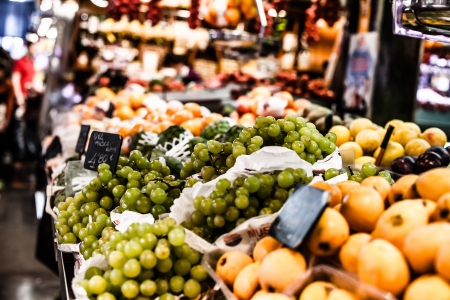 Fruits stand in La Boqueria market, Barcelona Spainの写真素材