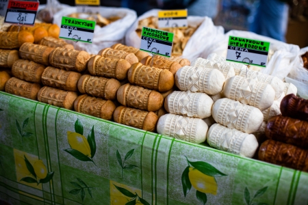 Traditional polish smoked cheese oscypek on outdoor market in Zakopane の写真素材