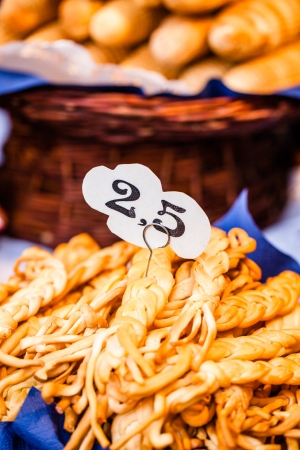 Traditional polish smoked cheese oscypek on outdoor market in Krakow, Poland. の写真素材