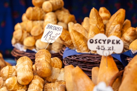 Traditional polish smoked cheese oscypek on outdoor market in Krakow, Poland. の写真素材