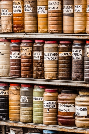 Jars of herbs and powders in a indian spice shop.の写真素材