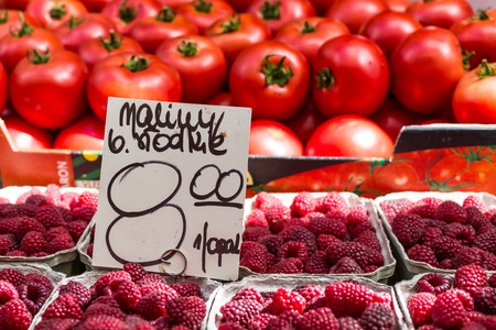 Red raspberries in boxes at local farm market in Poland. の写真素材