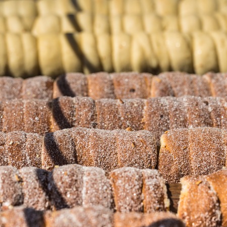 Baking of czech trdelnik on the street of Pragueの写真素材