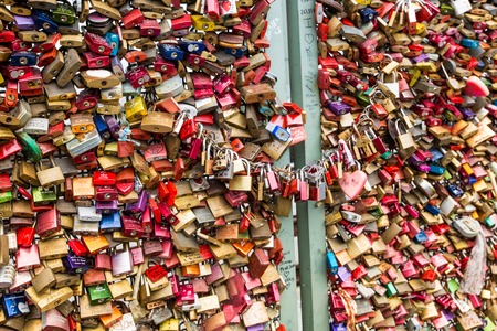 COLOGNE, GERMANY - AUGUST 26, 2014, Thousands of love locks which sweethearts lock to the Hohenzollern Bridge to symbolize their love on August 26 in Koln, Germany のeditorial素材