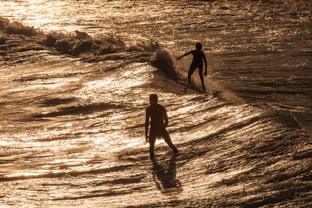 Surfer Rides a Large Blue Tropical Wave in Paradise の写真素材