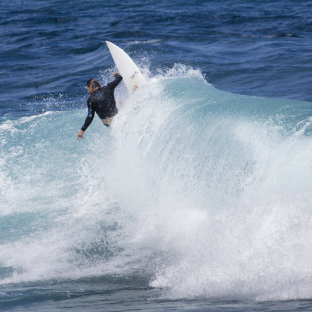 Extreme surfer riding giant ocean wave in Hawaiiのeditorial素材
