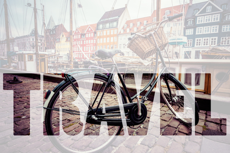 Word TRAVEL over Classic vintage retro city bicycle in Copenhagen, Denmarkの写真素材