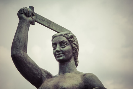 The Warsaw Mermaid called Syrenka on the Vistula River bank in Warsaw, Polandの写真素材