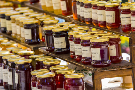 Glass jars with honey backgroundのeditorial素材