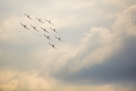 RADOM, POLAND - AUGUST 23: Aerobatic group formation "Frecce Tricolori" italian aerobatic Team at blue sky during Air Show Radom 2015 event on August 23, 2015 in Radom, Polandのeditorial素材