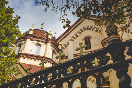 Domes of Our Lady of the Sign Church, the orthodox church between trees in Vilnius, Lithuaniaの写真素材
