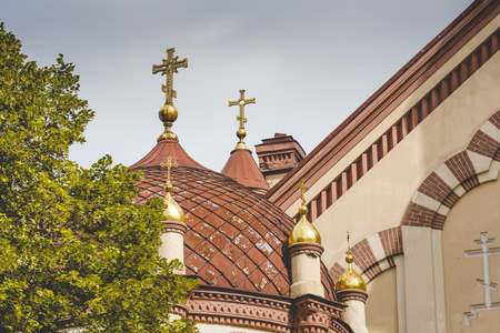 Domes of Our Lady of the Sign Church, the orthodox church between trees in Vilnius, Lithuania