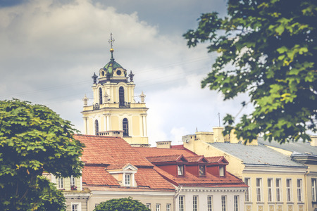 bell tower in the morning light in Vilnius on background blue skyの写真素材