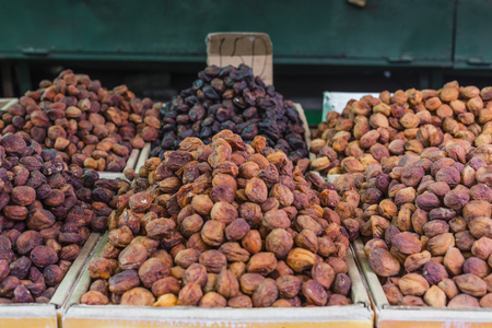 Dry fruits and spices like cashews, raisins, cloves, anise, etc. on display for sale in a Osh bazaar in Bishkek Kyrgyzstan.の写真素材
