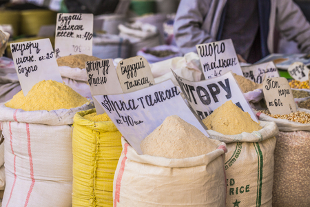 Vivid oriental central asian market with bags full of various spices in Osh bazar in Bishkek, Kyrgyzstan.の写真素材