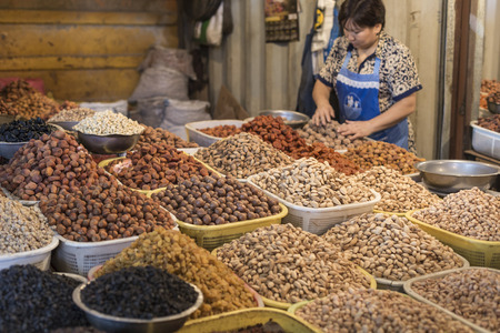 Spices and vegetables in bags at local bazaar in Osh. Kyrgyzstan.のeditorial素材
