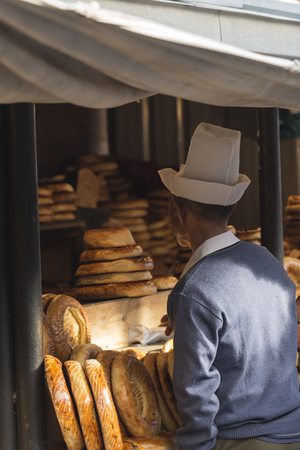 Kirghiz bread tokoch on Sunday market in Osh. Kyrgyzstan.のeditorial素材