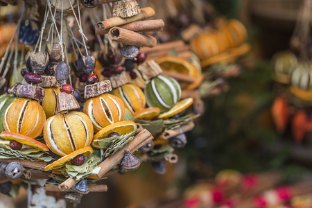Christmas decorations made with dried fruits. Christmas garland, chaplet to decorate christmas tree. Home-made decorations sold during Christmas market.の写真素材