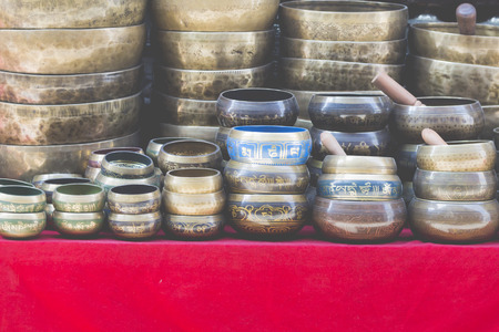 Several singing bowls displayed at a market in Kathmandu, Nepal