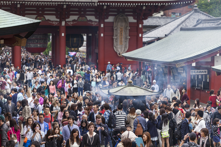 TOKYO, JAPAN -MAY 2: Crowd of japanese people walking around the most famous Sensoji buddhist temple, 2014 in Tokyo, Japan. The temple is the oldest in all of Tokyo and a popular destination during New Year.のeditorial素材