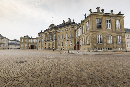 COPENHAGEN, DENMARK -SEPTEMBER 8: Castle Amalienborg with statue of Frederick V in Copenhagen, Denmark in September 8, 2014. The castle is the winter home of the Danish royal familyのeditorial素材