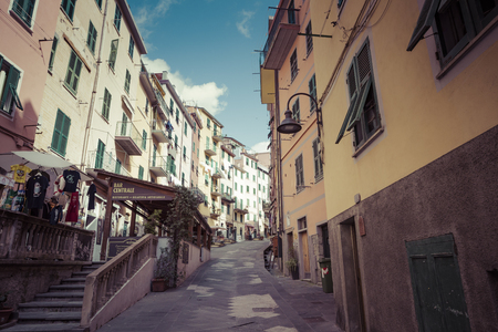 RIOMAGGIORE, ITALY - 05 MARCH, 2016 :People walking on the street of Riomaggiore village in Italy. Riomaggiore is one of five famous coastline villages in the Cinque Terre National Park, Liguria.のeditorial素材