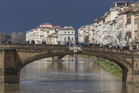 FLORENCE, ITALY - MARCH 07: Ponte Santa Trinita bridge over the Arno River shown on March 07, 2016 in Florence, Italy. The Ponte Santa Trinita is the oldest elliptic arch bridge in the worldのeditorial素材