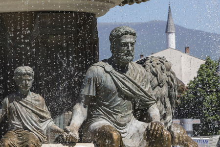 Large water fountain and bronze sculptures of adults and children in Skopje, Macedonia, Europe.のeditorial素材