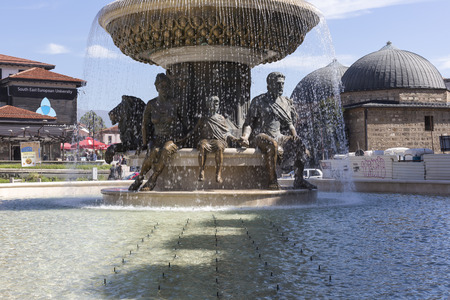 SKOPJE, MACEDONIA - APRIL 14, 2016: Large water fountain and bronze sculptures of adults and children in Skopje, Macedonia, Europe.のeditorial素材