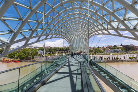 TBILISI, GEORGIA - MAY 07: The Bridge of Peace is a bow-shaped pedestrian bridge over the Kura River in Tbilisi, capital of Georgia on may 07, 2016のeditorial素材