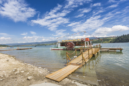 NIEDZICA, POLAND - JUNE 21: Cruise ship on the lake Czorsztynskie in Pieniny Mountains  on June 21, 2016 in Niedzica.のeditorial素材