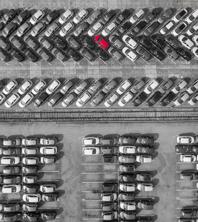 Aerial view lot of vehicles on parking for new car. Black and White selective red colour.の写真素材