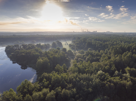 Sunraise morning summer time lake and green forest, in Poland lanscape. View from above.の写真素材
