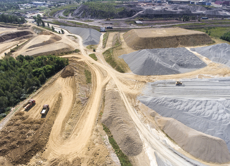 Aerial view over the building materials processing factory. Sand mine. View from above.
